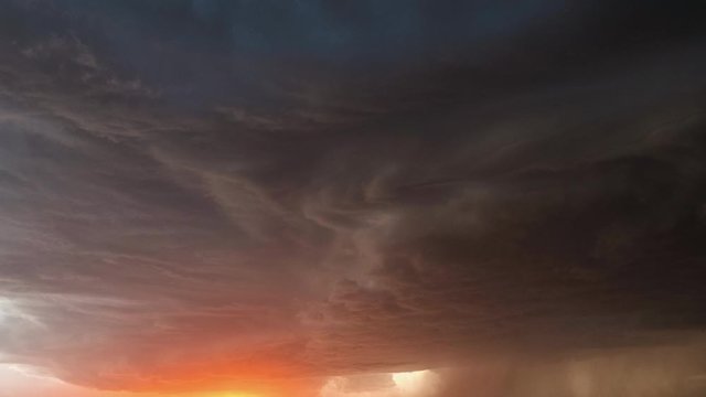 Time lapse of lightning flashing in dramatic storm during sunset in the monsoon season.