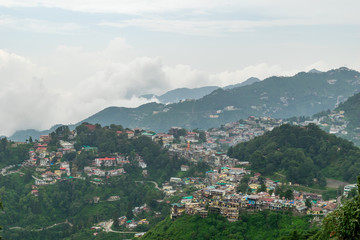 Fototapeta na wymiar A panoramic view of the Mussoorie cityscape from Landour, Uttarakhand, India
