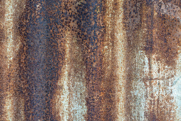 Rusty metal texture or background with streaks of rust. rusty metal wall, .old sheet of iron covered with rust and corrosion paint. .Oxidized iron panel.