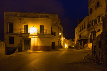 Night view of the old streets in the Tetouan Medina quarter in Northern Morocco. A medina is typically walled, with many narrow and maze-like streets.