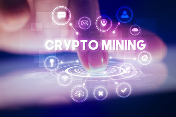 Finger touching tablet with web technology icons and CRYPTO MINING inscription, web technology concept