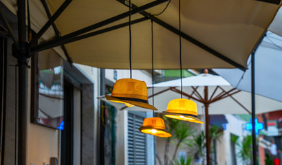 Cozy restaurant on the street in Manarola, Italy. Vintage lamp hanging from ceiling.