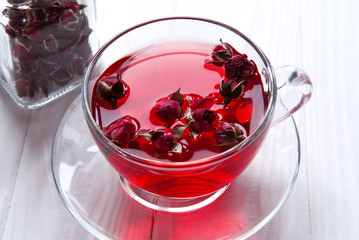 Hibiscus flower tea with a sweet rose. Glass cup with flower tea