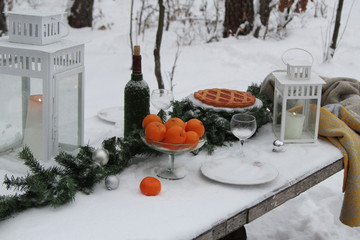 Christmas table in the winter forest