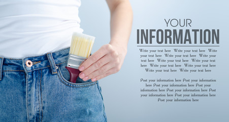 Woman put in pocket paint brush on gray light background. Isolation, space for text