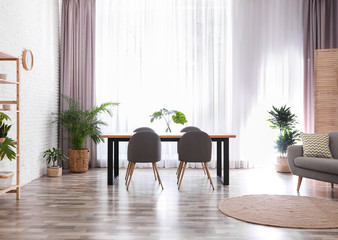 Stylish room interior with green plants. Home decoration