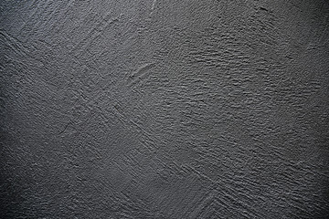 Dark stone background. Texture. Close-up.