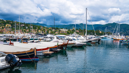 Fototapeta na wymiar Fantastic summer vacation destination, superb Santa Margareta Luguria mediterranean cityscape with colorful buildings and boats, yachts in the bay. Italy, Europe.