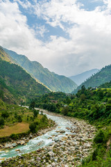 Fototapeta na wymiar A mountain river, Gushaini, Tirthan Valley, Himachal Pradesh, India