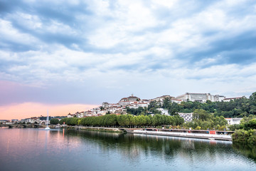 Fototapeta na wymiar Cityscape view of Portugal town Coimbra in late afternoon