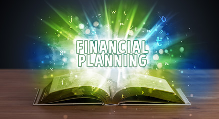 FINANCIAL PLANNING inscription coming out from an open book, educational concept