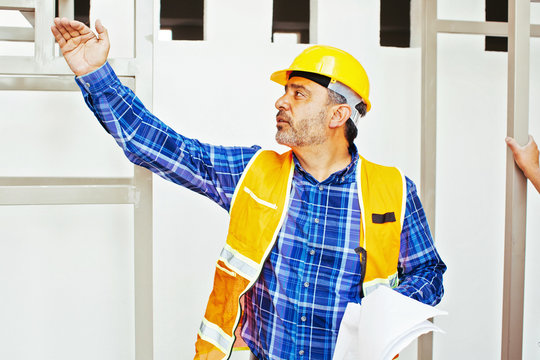 Architect in hardhat and vest