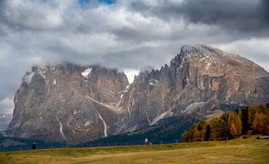 Mountain landscape with  and unrecognised people hiking  at the at the famous Alpe di Siusi valley South Tyrol in Italy