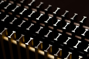 Fototapeta premium Abstract background in the form of slices of t-shaped profiles of different colors, located at an angle to the camera.
