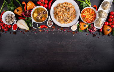 The concept of Eastern asian festive cuisine. Assorted Uzbek food set, pilaf, samsa, lagman, manti, shurpa restaurant concept Eastern arabic new year and Christmas dish from lamb served cookware.