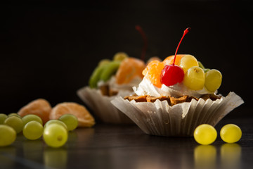 Cake with grapes Mandarin and cherry