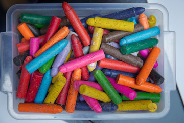 Crayons on the table. Montessori wood color gamut . crayon and paper photos on the table, colorful theme backgrounds, drawing theme wallpapers. Plastic box