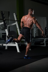Fototapeta na wymiar Mature Man Flexing Muscles
