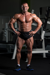 Fototapeta na wymiar Portrait Of A Fitness Muscular Mature Man