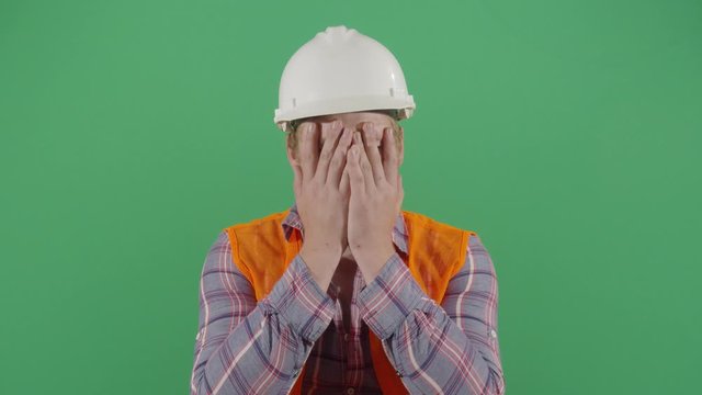 Adult Man Engineer Rubbing Face With Frustration