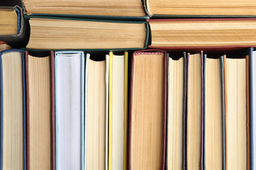 Many different hardcover books as background, top view
