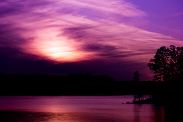 Fototapeta na wymiar A colorfull twilight sky over a lake.