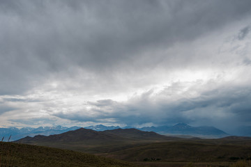 Fototapeta na wymiar storm clouds over Sierra Nevada mountains and hills of California