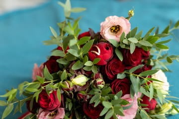 golden wedding rings hidden in bouquet