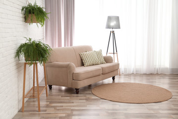 Modern comfortable sofa in stylish home interior