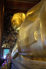 The world's largest sculpture of a reclining Buddha in a temple in Bangkok. © Oleksii