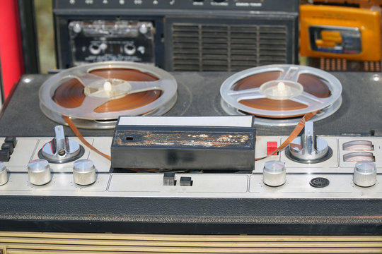 Old reel-to-reel tape recorder on the table
