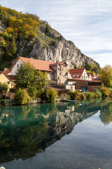 Idyllic view at the village Markt Essing in Bavaria, Germany with the Altmuehl river and high rocks