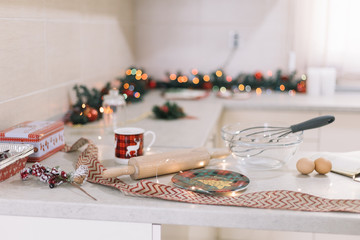 Christmas decorated kitchen with ingredients for cookies