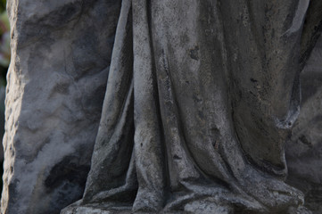 Monument and candles in the cemetery. All Saints Day in Poland.
