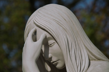 Monument and candles in the cemetery. All Saints Day in Poland.