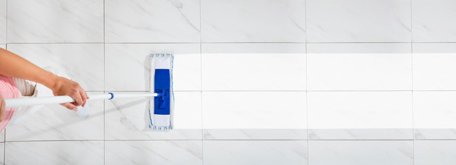 Woman Mopping The Floor