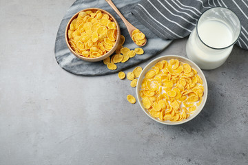 Flat lay composition with tasty corn flakes on light grey table