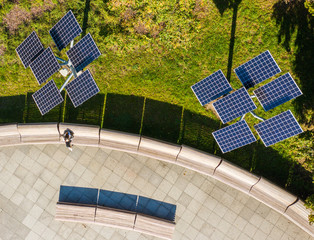 Aerial view of solar panels or solar panels Platform in a city park in Warsaw.  Poland. Photovoltaic solar panels absorb sunlight as an energy source for generating electricity. 