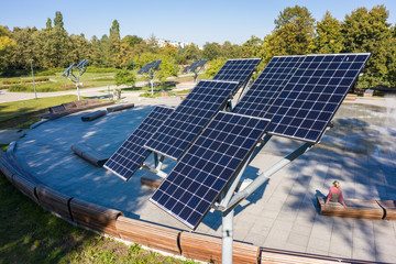 Aerial view of solar panels or solar panels Platform in a city park in Warsaw.  Poland. Photovoltaic solar panels absorb sunlight as an energy source for generating electricity. 