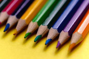 Color Pencils on yellow background. Colored Pencils Background. Crayons Close Up. - Image