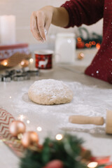 Dough on countertop with spilled flour and rolling pin