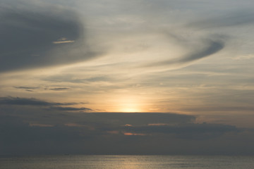 Beautiful dawn, morning sun rises by the sea. Scenic beach, coastline, rocks, cloudscape and skyline photography. Sunrise during the early hours of a summer morning by the beach. Sunset by the beach.