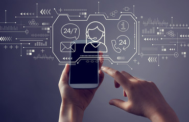 Customer service 24 hours 7 days a week with person holding a white smartphone