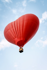 Heart shaped balloon soars in the sky