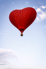 Heart shaped balloon soars in the sky