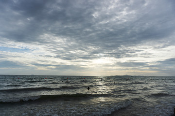 Beautiful dawn, morning sun rises by the sea. Scenic beach, coastline, rocks, cloudscape and skyline photography. Sunrise during the early hours of a summer morning by the beach. Sunset by the beach.