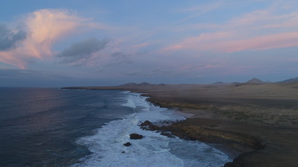 Contemplating the force of the sea and the sunset from a wonderful place