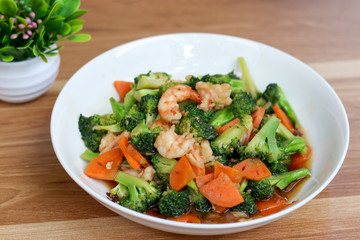 Stir Fried Broccoli with Shrimp on wooden table.