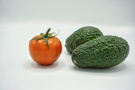 tomato and avocados isolated on a white background