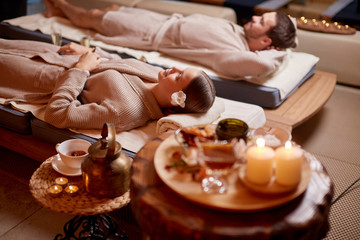 young man and woman, couple in love relaxing together at spa salon, after enjoying treatment, health and body care, holiday weekend